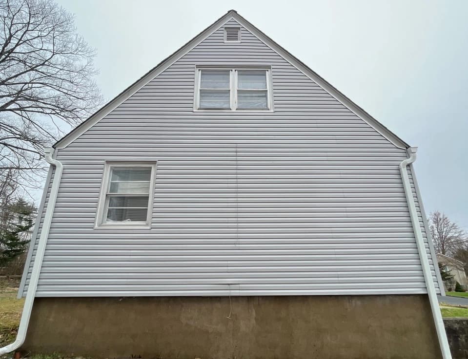 Rocky River Power Washing technician performing detailed house washing in Rocky River residential area